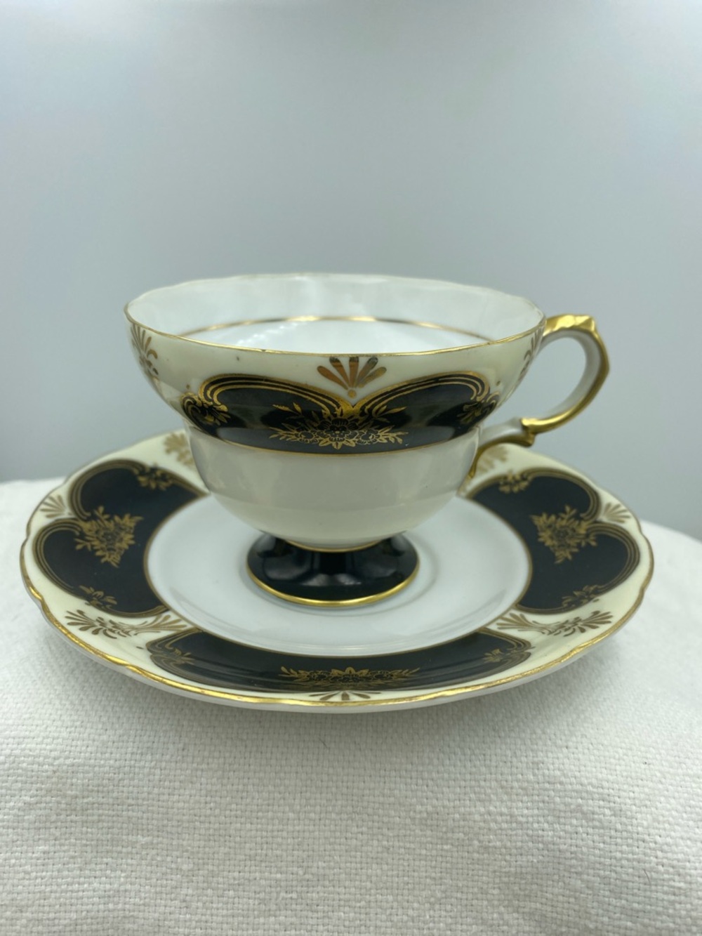 Shafford Elegant Black and Gold Porcelain Teacup and Saucer Set